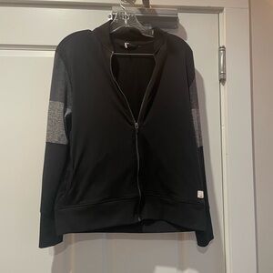 Vuori Black Sweatshirt with Cream Logo Patch